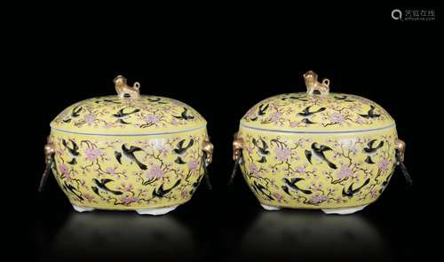 A pair of porcelain bowls with lid with a decor of swallows and cherry blossoms on a yellow backdrop, China, Qing Dynasty, Guangxu Period (1875-1908)