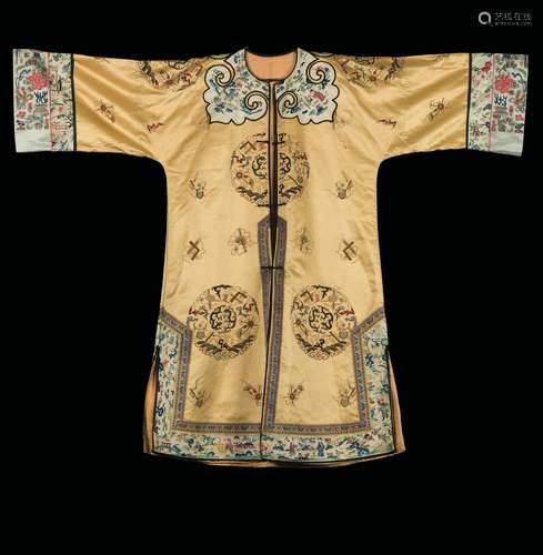 A yellow-ground silk dress embroidered with a naturalistic motif, China, Qing Dynasty, 19th century