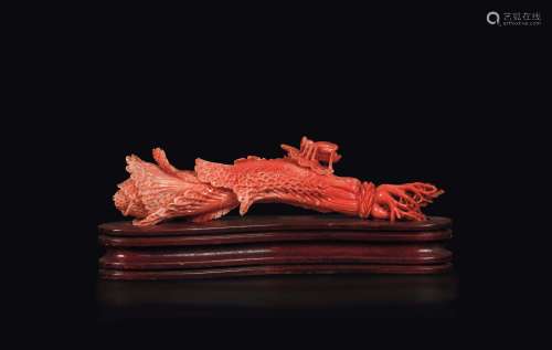 A carved coral group depicting a vegetable and a bug, China, early 20th century