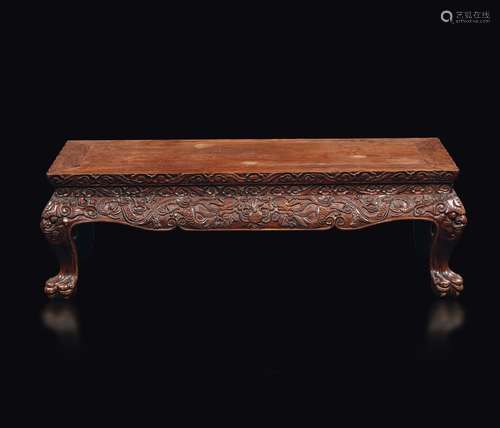 A homu wood tea table with feral legs and naturalistic decor, China, Qing Dynasty, 19th century