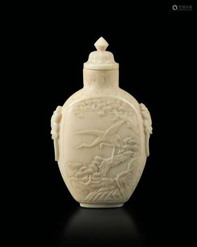 An ivory snuff bottle with a figure of cranes in a landscape, China, Qing Dynasty, 19th century