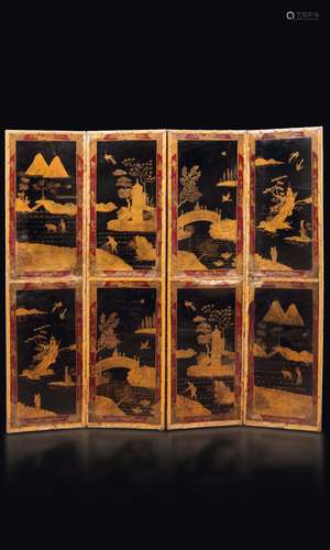 A lacquered four-fold wooden screen with golden landscape depictions on a black backdrop, China, Qing Dynasty, 19th century