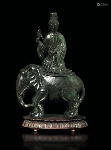 A group in spinach and russet jade depicting Guanyin on an elephant, China, Qing Dynasty, 19th century