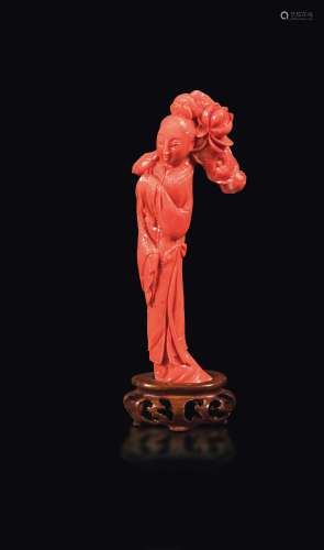 A small carved coral Guanyin with roses, China, early 20th century