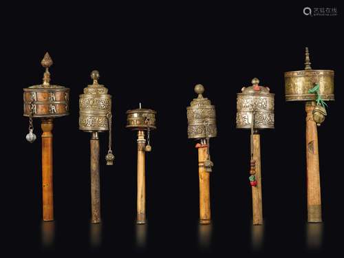 Six copper prayer wheels with semi-precious stone inlays, Tibet, 19th century