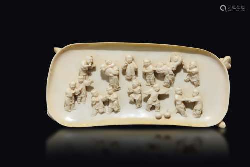An ivory plaque with a decor of children, China, Qing Dynasty, 19th century