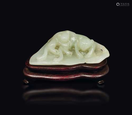 A carved white jade plaque depicting cats, China, Qing Dynasty, 19th century
