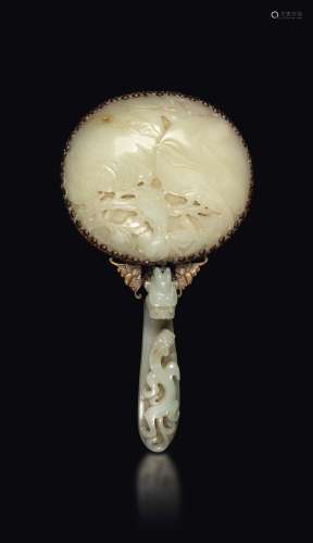 A mirror with a white jade plaque with naturalistic motifs and handle with a dragon-shaped buckle, China, Qing Dynasty, Qianlong period (1736-1796)