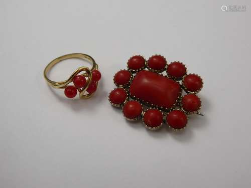 An Antique Coral Pendant, approx 32 x 27 mm together with a 14 ct yellow gold and red-stone ring, size M, approx 8.7 gms.