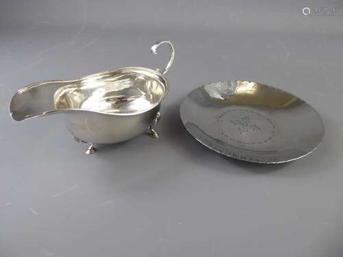 A Silver Sauce Boat, London hallmark, dated 1931, mm RS (rubbed) together with a silver pin dish, Sheffield hallmark, dated 1903, mm HA approx 75.9 gms with a silver plated Keswick dish. (3)