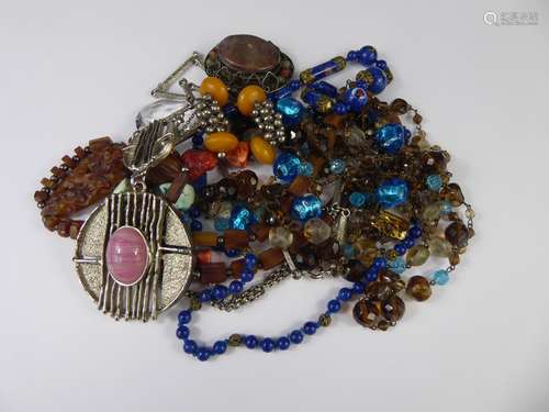 A Collection of Vintage and Other Costume Jewellery, including a five-strand glass beaded necklace, Murano blue glass necklace, retro disk pendant and chain, a hard-stone and turquoise necklace, brown beaded necklace and an enamel egg pendant.