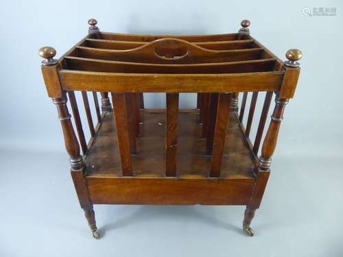 A Mahogany Edwardian Canterbury with four divisions above a single drawer, turned supports and casters, approx 48 x 34 x 54 cms.