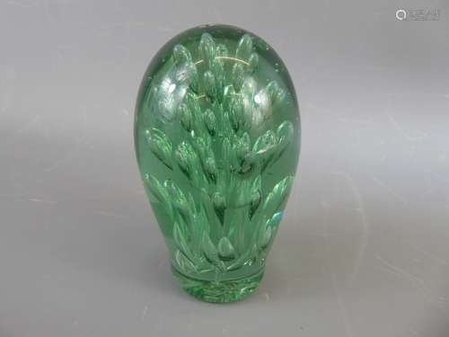 A Victorian Green Glass Dump Paperweight.