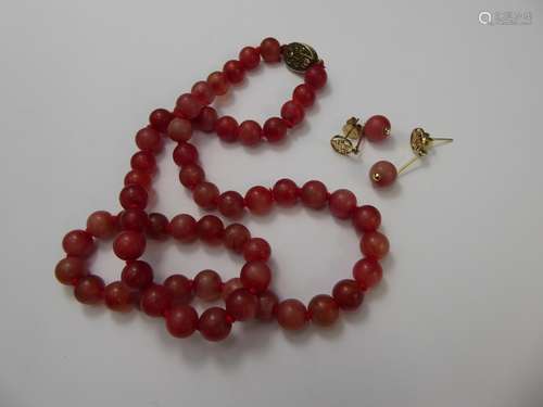 A Chinese Pink Stone Beaded Necklace, on silver-gilt clasp together with similar 9 ct gold earrings (tested)