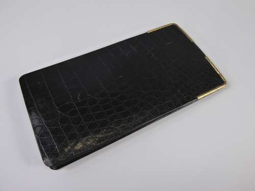 A Harrods Crocodile and Gold Plated Cigar Wallet, approx 8.5 x 15 cms.