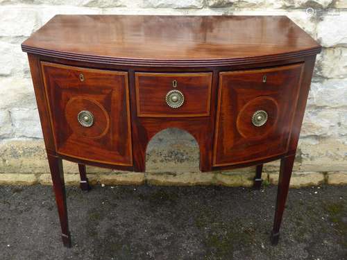 An Antique Mahogany Demi-Lune Sideboard, the sideboard having two deep storage drawers to sides and a central drawer with brass ring handles, straight legs approx 98 x 56 x 92 cms.