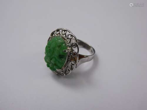 A Chinese 14ct/15 ct  White Gold and Apple Jade Ring, size L, approx 5.6 gms.