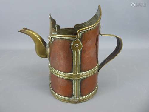 A 19th Century Tibetan Copper and Brass Monk's Cap Jug/Ewer with banded design, approx 19 cms high.