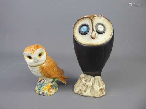 A Pair of Vintage Beswick Owls, one with blinking eye, model no 2238, the other, a Barn owl, model no. 2026, approx 17 cms and 12 cms respectively.