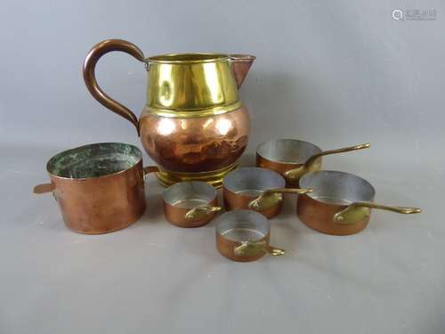 A Copper and Brass Ale Jug together with a set of six (possibly French) miniature saucepans. (7)