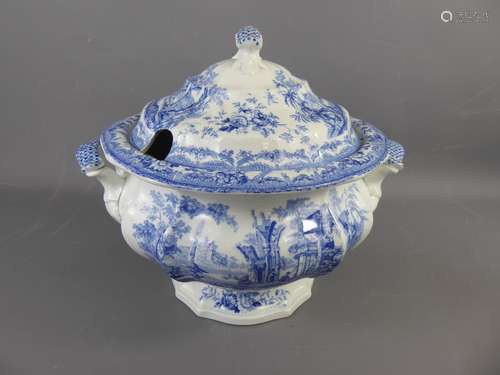 A Large English Porcelain Blue and White Soup tureen, depicting abbey ruins, approx 36 cms h, approx 35 cms diameter, raised on circular pedestal base.