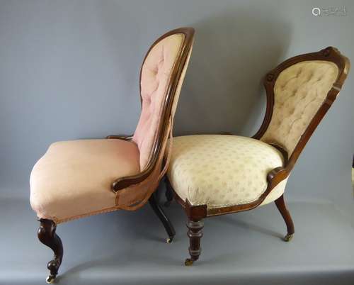 An Antique Button Back Nursing Chair with cabriole legs on brass casters and covered in shell pink fabric together with another button-back nursing chair covered in dusty pink linen fabric. (2)