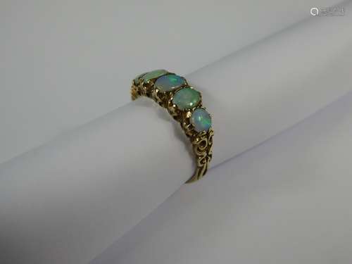 An Antique 9 ct Yellow Gold and Opal Ring, one opal 5 x 3.7 mm, two opal 4.8 x 3.5 mm and a further two 3.5 mm, size O, approx 3 gms.