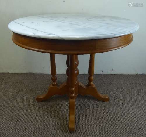 A Chinese White Marble Topped Circular Breakfast Table, with four spindle backed chairs with cane seating, originally from Singapore.