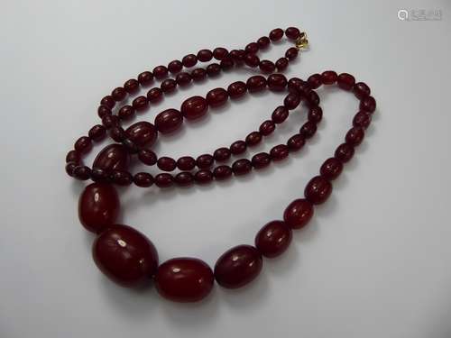 A Set of Antique Graduated Amber Beads, approx 94 cms, beads measure from 9mm to 30mm, approx 68 gms.