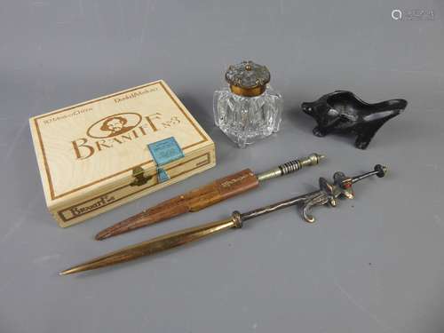 A Vintage Gentleman's Lot, including a black metal cigar/pipe holder and sealed box of 50 Braniff No 3 'Mexico Chicos' cigars, a brass and glass inkwell and ethnic brass letter opener together with a small Spanish knife in leather sheath, approx 21 cms.