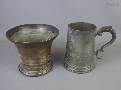 An Antique Pewter Tankard, marked with a military badge bearing 2 B.R.B surrounded by laurel leaf inscribed 'Sergeant W.F. Bills', approx 16 x 9.5 cms dia (glass base cracked) together with a very heavy bronze pestle, approx 14 x 17 cms dia.