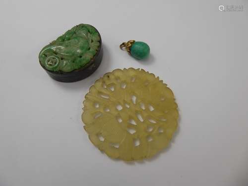 A Chinese Apple Jade Pill Box, approx 38 x 26 x 14 mm together with a white jade amulet approx 50 mm diameter together with a 9ct green stone pedant. (3)