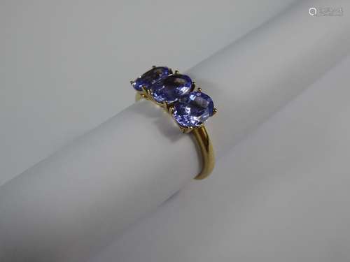 A 9ct Yellow Gold and Tanzanite Three Stone Ring, size O, three 7 x 5 mm tanzanite, approx 2.2 gms