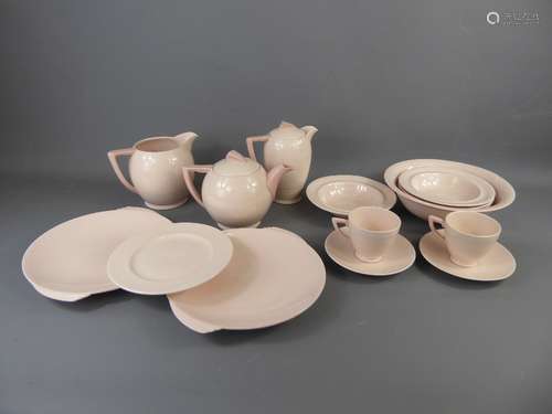 An Art Deco Wedgwood 'Blush Rose' Breakfast Set, comprising tea pot, coffee pot, six cups and saucers, milk jug, two serving plates, twelve small plates, sugar bowl and four cereal bowls.