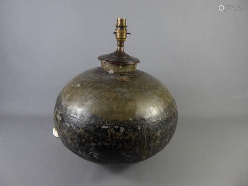 A Vintage Indian Hand-Beaten Metal Water Carrier, transformed into a table lamp base (no shade), approx 30 x 28 cms high.