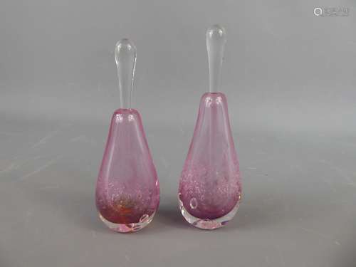 A Pair of Pink Glass Perfume Bottles with Stoppers, the bottles with inclusions made in Gordon Allen Australian studios, signed, approx 12 cms and 10 cms high.