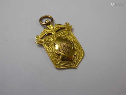 A 9ct Yellow Gold Flower Show Shield Medallion, dated 1912, approx 5.6 gms.