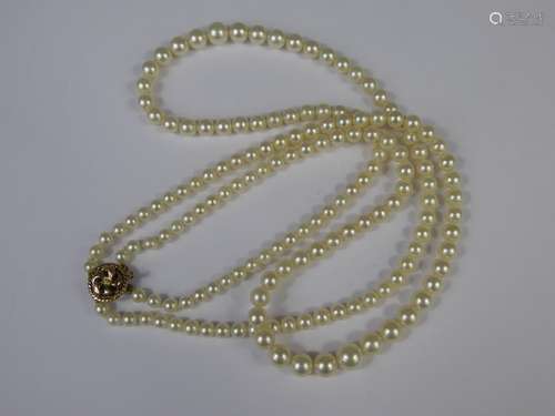 A Vintage Two-Strand Graduated Cultured Pearl Necklace, on 9 ct gold clasp, ranging from 4mm to 8mm, approx 42 cms.