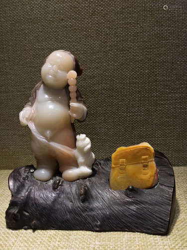 A BOY PATTERN SOAPSTONE CARVED DECORATION