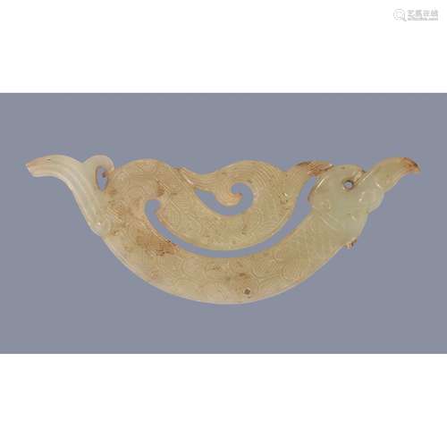 A small celadon jade Archaistic pendant