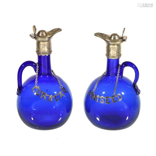 A pair of English blue-glass silver-plate mounted flasks and stoppers