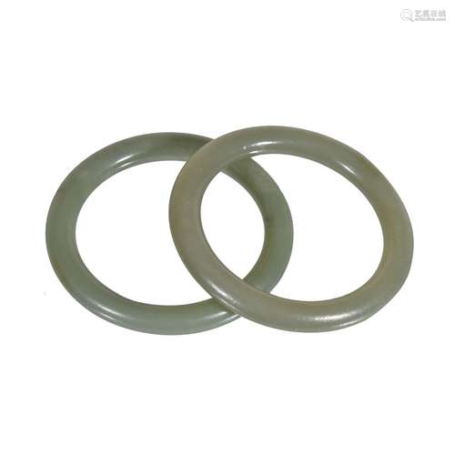 A pair of Chinese green jade bangles