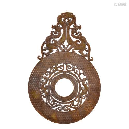 A Chinese Han-style reticulated brown and yellow jade disc