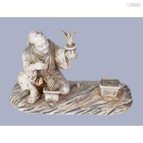 A Japanese Ivory Okimono’ comprising a rounded rectangular base upon which a gardener kneels amongst potted plants which he is tending