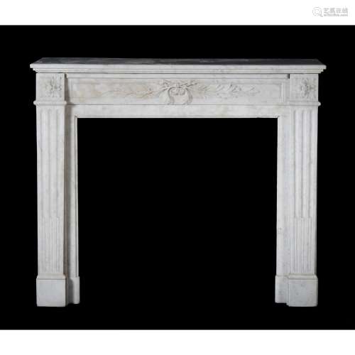 A mottled white marble chimneypiece in Louis XVI style
