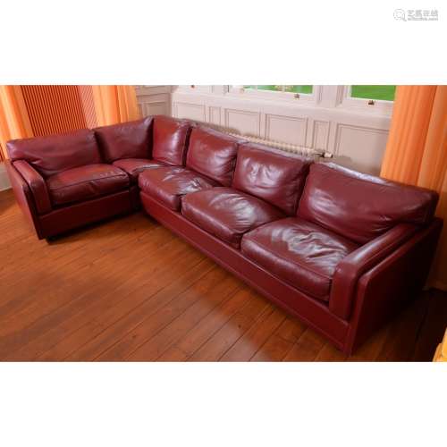 A maroon leather corner sofa by Poltrona Frau