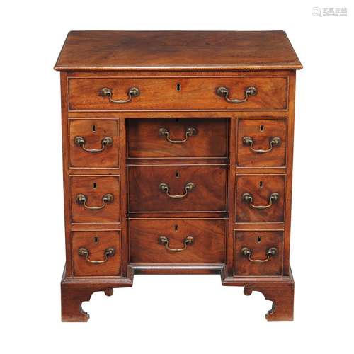 A mahogany kneehole desk in George III style