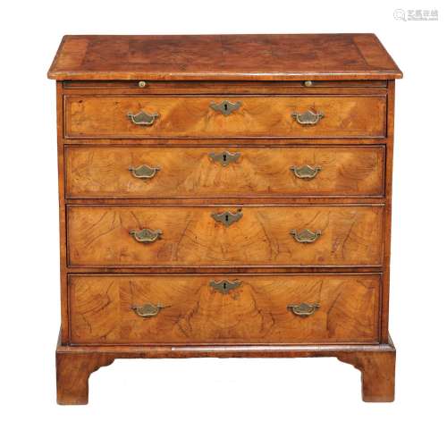 A George II walnut and feather banded bachelor’s chest of drawers
