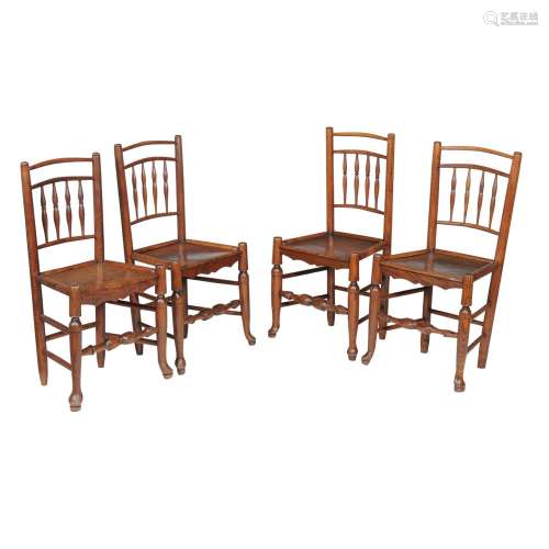 A harlequin set of four elm side chairs