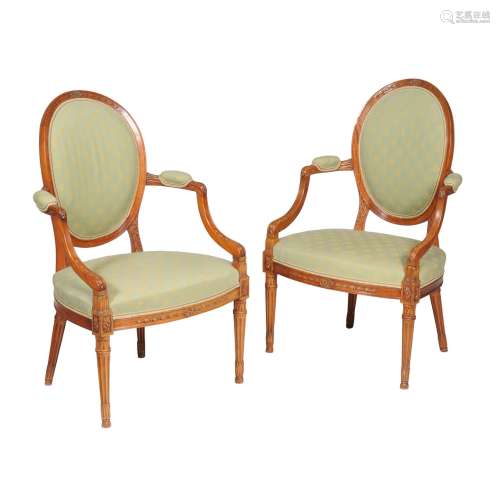 A pair of solid satinwood open armchairs in George III style